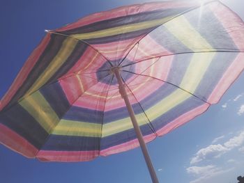 Low angle view of umbrella against sky