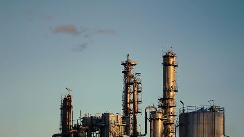 Low angle view of factory against sky