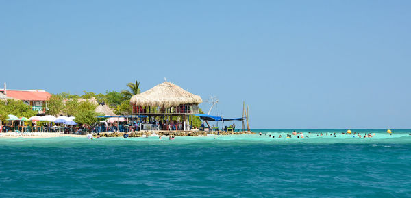 Scenic view of sea against clear blue sky
