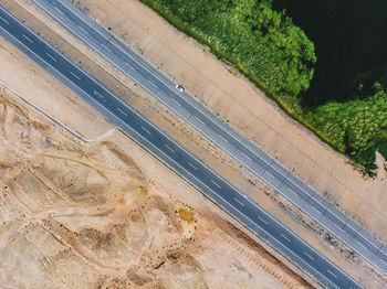 High angle view of railroad tracks by road