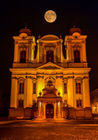 Low angle view of illuminated building at night