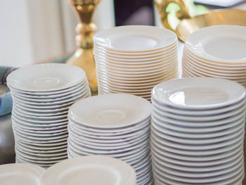 High angle view of plates stack on table
