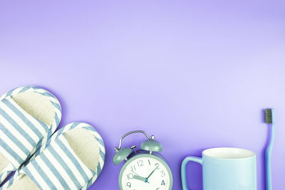 Close-up of clock against blue background