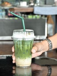 Cropped image of hand holding drink