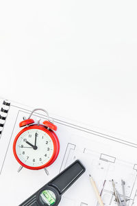 Low angle view of clock tower against white background