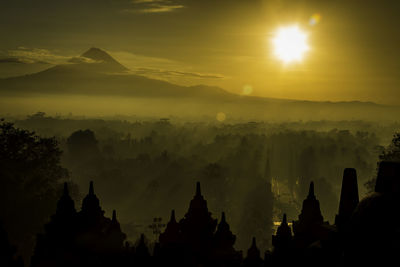 Panoramic view of temple against sky during sunset