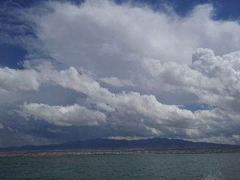 Scenic view of mountains against cloudy sky