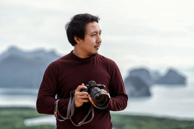 Portrait of man photographing