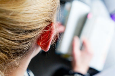 Close-up of woman reading book