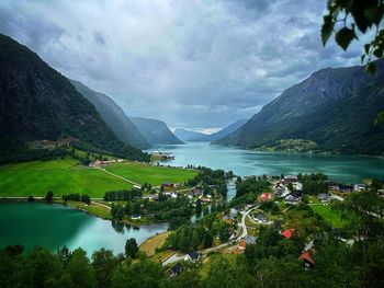 Scenic view of lake and mountains against sky