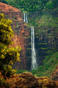 Scenic view of waterfall on mountain