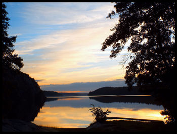 Scenic view of lake at sunset