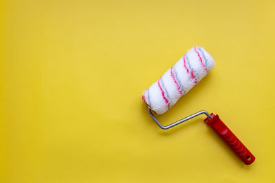 High angle view of cupcakes on yellow background