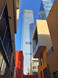 Low angle view of buildings against sky in city