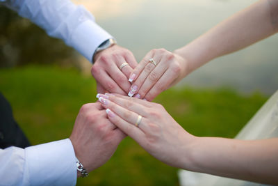 Close-up of the hands of a bride and a groom