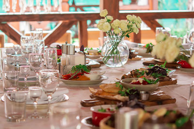 Beautifully decorated festive table with various types of salads and appetizers 