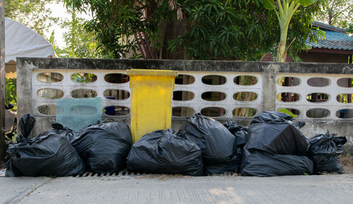 Black garbage bags and yellow a trash