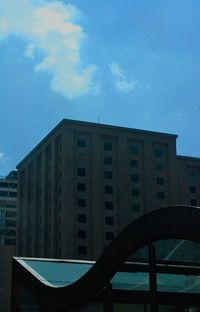 Low angle view of building against blue sky