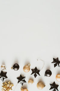 Close-up of christmas decorations on white background