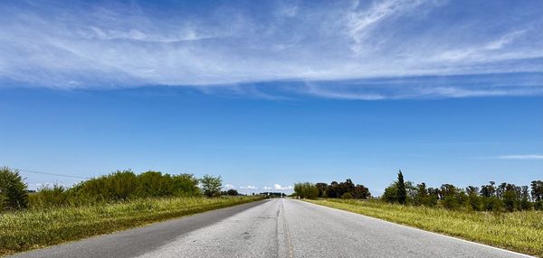 Empty road against sky