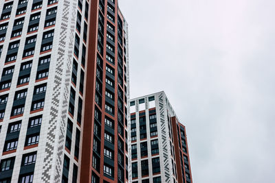 Low angle view of modern buildings against sky