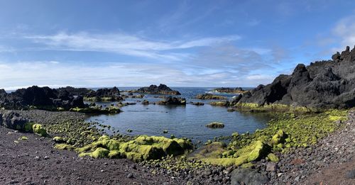 Panoramic shot of rocks on land against sky