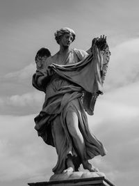 Low angle view of statue of liberty against sky