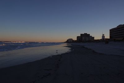 Scenic view of beach against clear sky