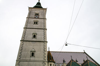 Low angle view of clock tower against sky