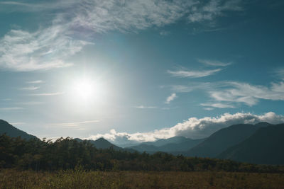 Scenic view of field against sky during sunset