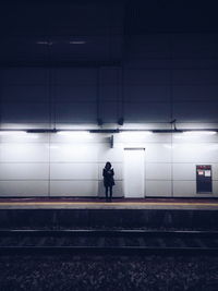 Woman on railroad track