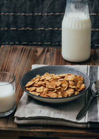 Close-up of cerial and milk on table