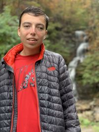 Portrait of young man standing outdoors