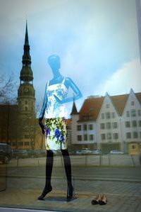 Full length of woman standing on railing