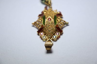 High angle view of ornate decoration on white background