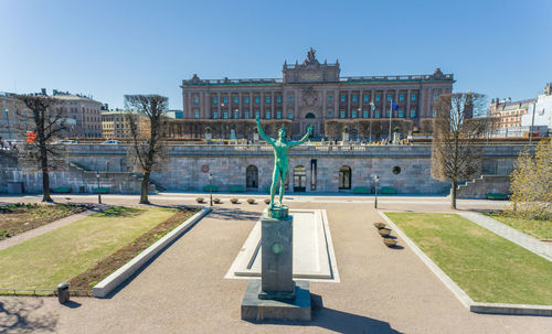 Sun singer statue is located in stromparterren, the oldest public park in stockholm, sweden