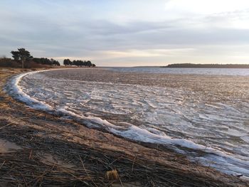 Scenic view of sea against sky during winter