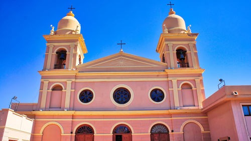 Low angle view of building against blue sky