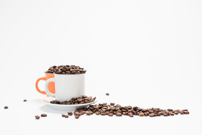 View of coffee beans against white background