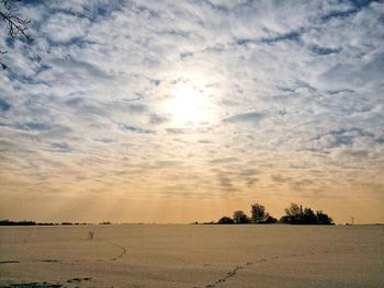 Scenic view of field against sky during sunset