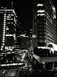 Illuminated city street at night