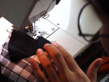 Woman using sewing machine