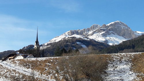 Scenic view of snowcapped mountains against sky