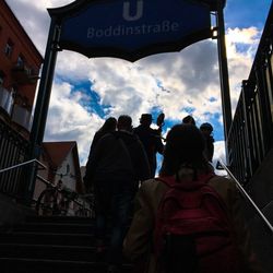 People in city against sky