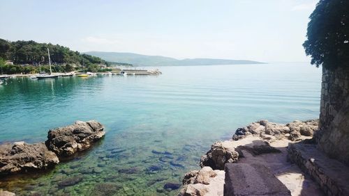 Scenic view of bay against sky