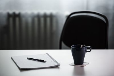 Close-up of coffee cup on table