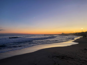 Scenic view of sea against sky during sunset, sitges. 