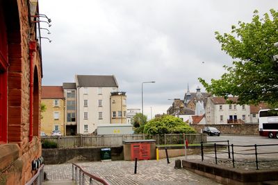 Houses in town against sky