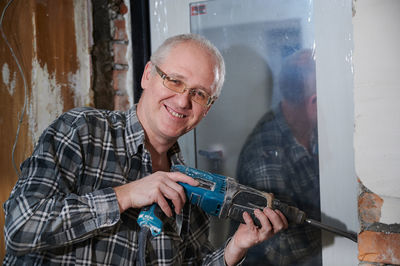 Portrait of man working in workshop