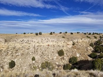Panoramic view of landscape against blue sky